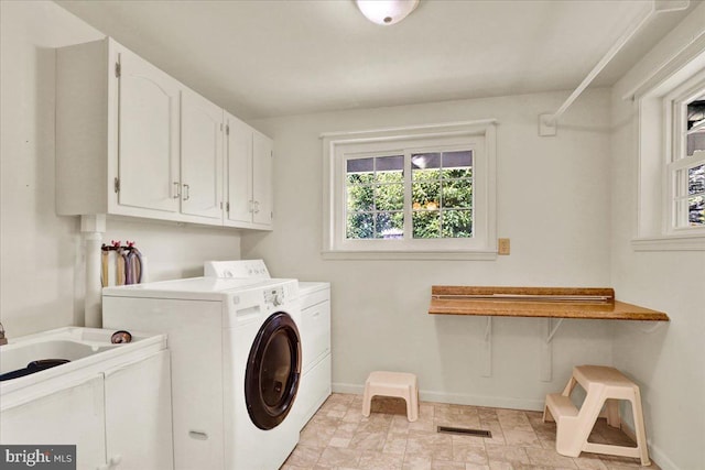 217 E Chestnut St, Cleona, PA 17042 - washroom with plenty of natural light, cabinet space, washer and dryer, and baseboards