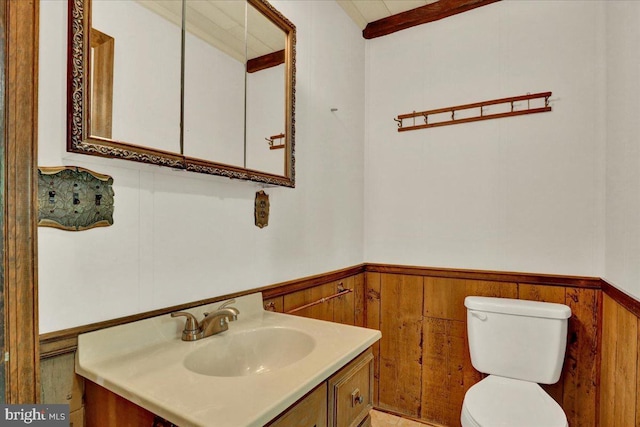 217 E Chestnut St, Cleona, PA 17042 - half bath featuring wainscoting, toilet, vanity, and wood walls