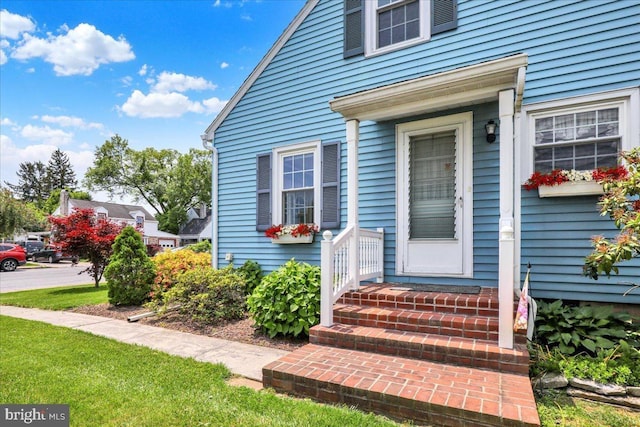 217 E Chestnut St, Cleona, PA 17042 - view of exterior entry featuring a lawn