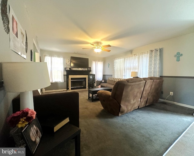 127 Miles Cir, Hurlock, MD 21643 - carpeted living room featuring a glass covered fireplace, a ceiling fan, and baseboards