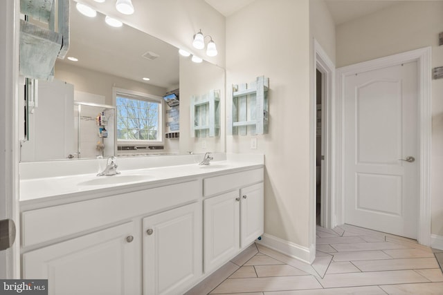 1257 N Fairfax Blvd, Ranson, WV 25438 - bathroom featuring double vanity, a shower with shower door, baseboards, and tile patterned flooring