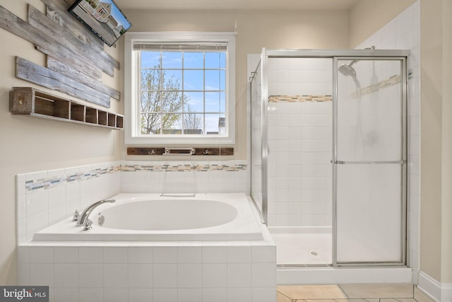 1257 N Fairfax Blvd, Ranson, WV 25438 - bathroom featuring a bath, a shower stall, and tile patterned floors