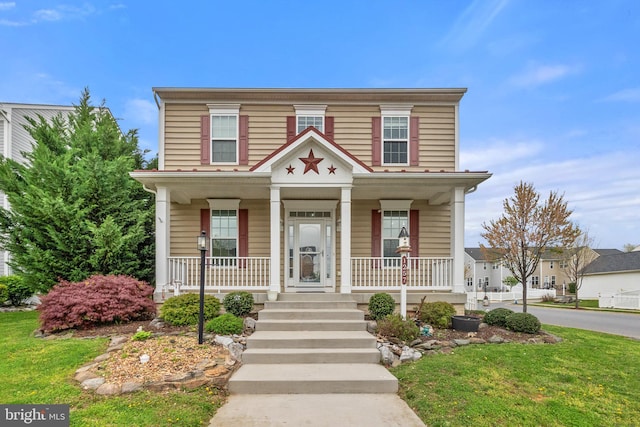 1257 N Fairfax Blvd, Ranson, WV 25438 - view of front of home with covered porch and a front yard