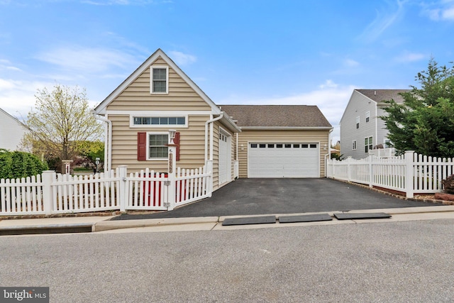 1257 N Fairfax Blvd, Ranson, WV 25438 - view of front of property with asphalt driveway and a garage
