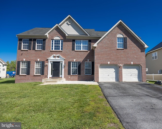 8 Bordeaux Blvd, Newark, DE 19702 - colonial-style house featuring asphalt driveway, brick siding, a front lawn, and a garage