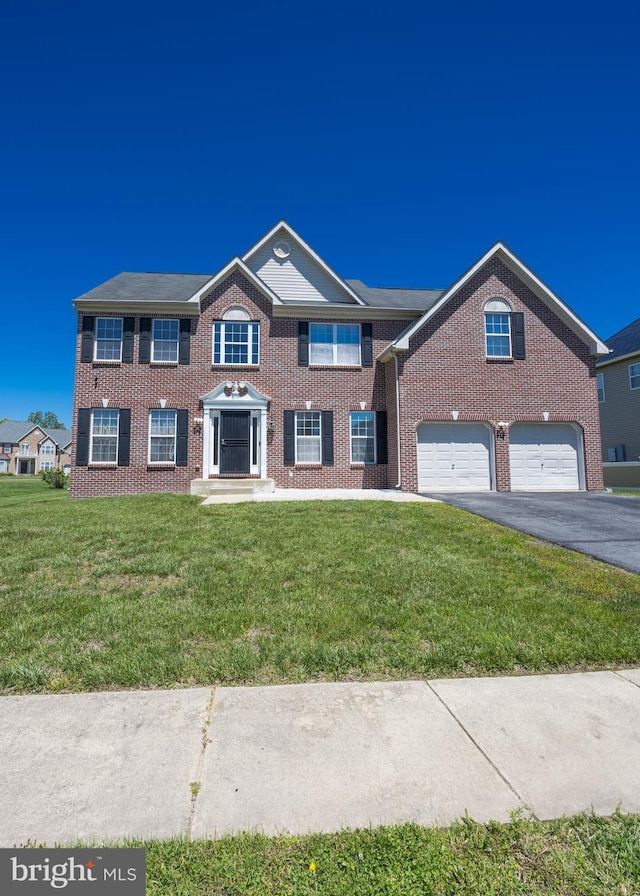 8 Bordeaux Blvd, Newark, DE 19702 - view of front of home featuring brick siding, driveway, and a front lawn
