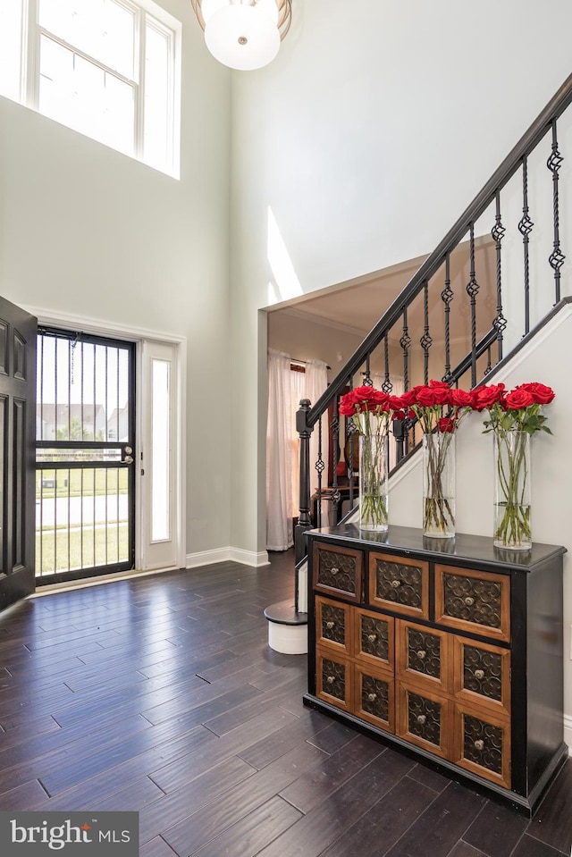 8 Bordeaux Blvd, Newark, DE 19702 - entrance foyer with a high ceiling, stairway, healthy amount of natural light, and dark wood-style floors