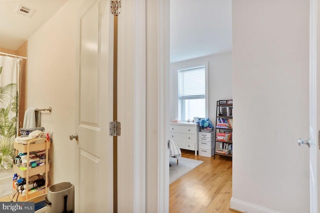 1443 Oak St NW Unit 102, Washington, DC 20010 - hallway with light wood-type flooring