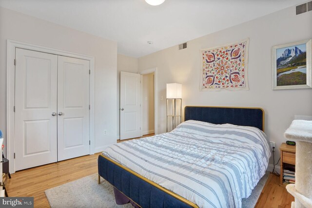 1443 Oak St NW Unit 102, Washington, DC 20010 - bedroom featuring light wood-style flooring, a closet, and baseboards