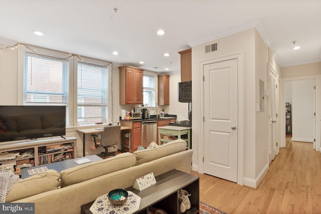 1443 Oak St NW Unit 102, Washington, DC 20010 - living area with crown molding, light wood-type flooring, recessed lighting, and baseboards