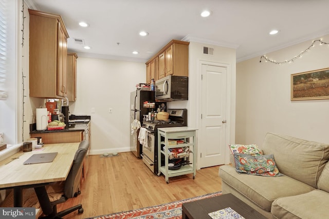 1443 Oak St NW Unit 102, Washington, DC 20010 - kitchen with appliances with stainless steel finishes, ornamental molding, light wood finished floors, recessed lighting, and baseboards