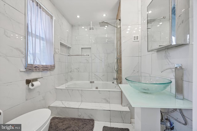722 Mason Ave, Drexel Hill, PA 19026 - full bathroom with toilet, tiled shower / bath, tile walls, and a sink