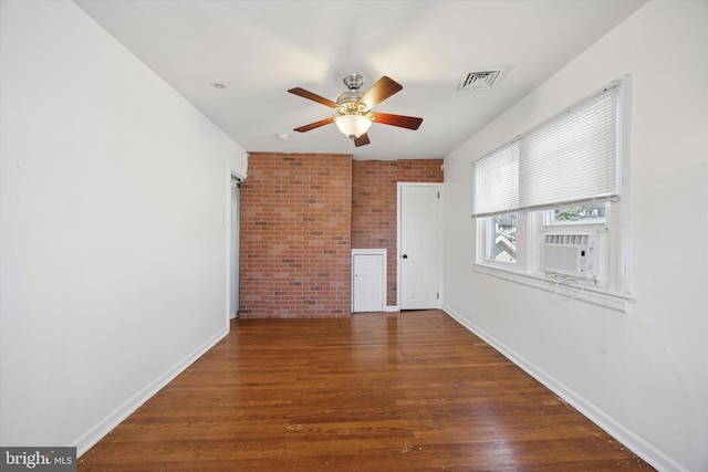 722 Mason Ave, Drexel Hill, PA 19026 - unfurnished room with a ceiling fan, brick wall, baseboards, wood finished floors, and cooling unit