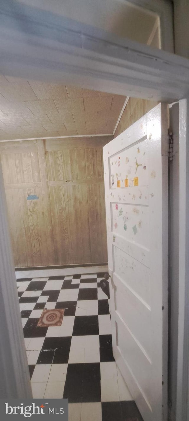 2207 W Lafayette Ave, Baltimore, MD 21216 - hall featuring tile patterned floors and wood walls