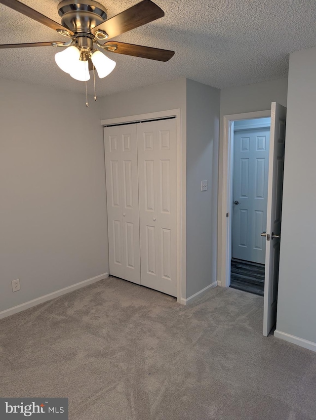 312 Mitten Ln, Mount Laurel, NJ 08054 - unfurnished bedroom with carpet, a closet, baseboards, ceiling fan, and a textured ceiling