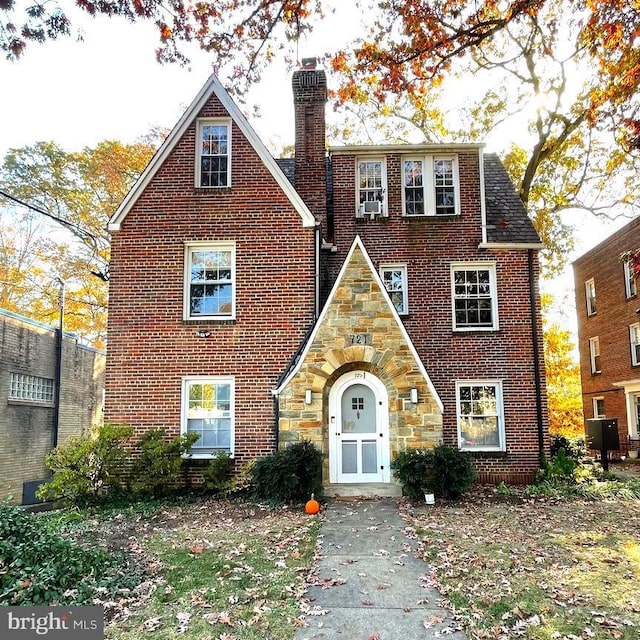 721 Erie Ave Unit 721-2, Takoma Park, MD 20912 - tudor home featuring a chimney, brick siding, and stone siding