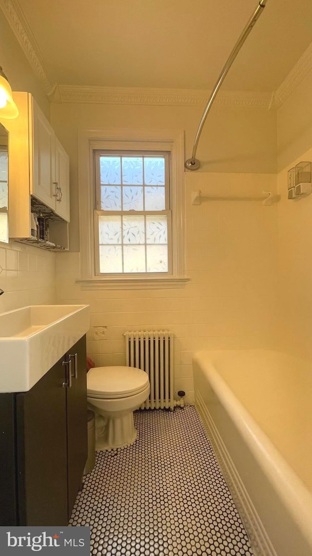 721 Erie Ave Unit 721-2, Takoma Park, MD 20912 - full bathroom with radiator, toilet, vanity, bathtub / shower combination, and ornamental molding