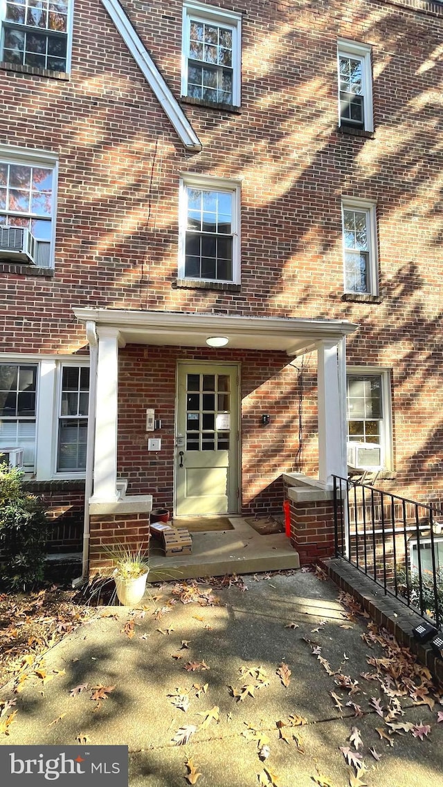 721 Erie Ave Unit 721-2, Takoma Park, MD 20912 - view of exterior entry featuring brick siding and cooling unit