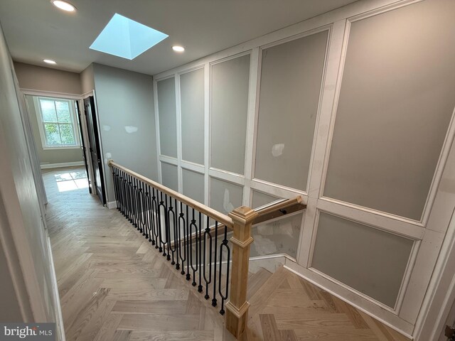 422 11th St SE, Washington, DC 20003 - staircase with a skylight, recessed lighting, baseboards, and a decorative wall