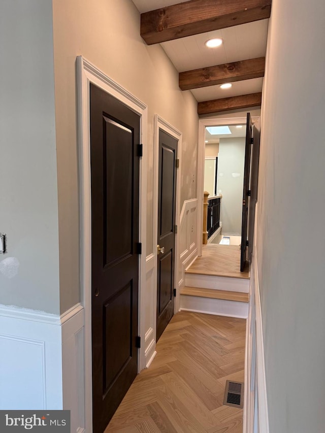422 11th St SE, Washington, DC 20003 - corridor featuring beamed ceiling, a wainscoted wall, recessed lighting, and a decorative wall