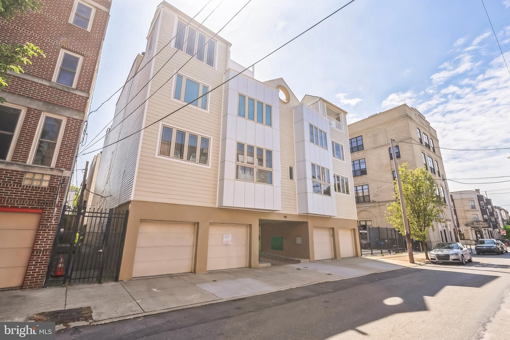 815 S 7th St Unit 3, Philadelphia, PA 19147 - view of apartment building / complex with an attached garage and driveway