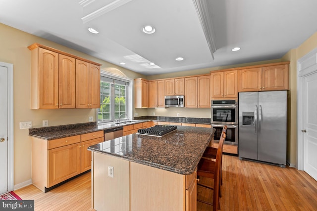 859 Empress Rd, West Chester, PA 19382 - kitchen featuring appliances with stainless steel finishes, recessed lighting, dark stone counters, a kitchen island, and light wood-style flooring