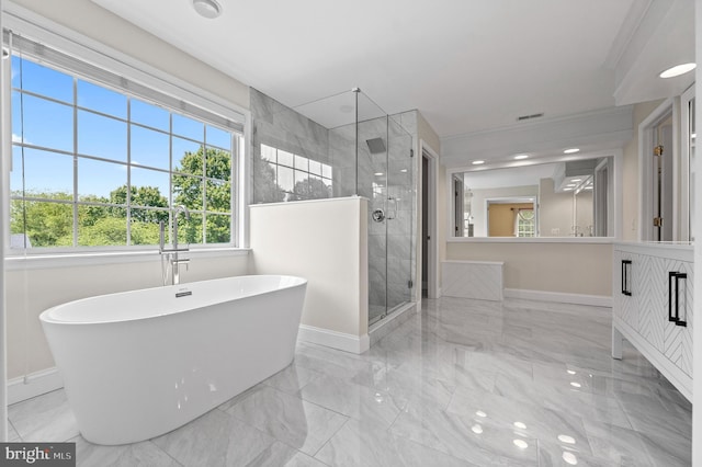 859 Empress Rd, West Chester, PA 19382 - bathroom featuring marble tiled flooring, baseboards, a freestanding tub, and recessed lighting