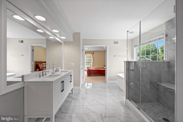 859 Empress Rd, West Chester, PA 19382 - ensuite bathroom featuring marble look tiles, double vanity, baseboards, a shower stall, and a freestanding tub