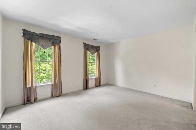 859 Empress Rd, West Chester, PA 19382 - spare room with plenty of natural light, light colored carpet, and baseboards