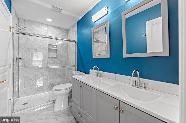859 Empress Rd, West Chester, PA 19382 - full bath with marble look tiles, double vanity, a shower stall, and toilet
