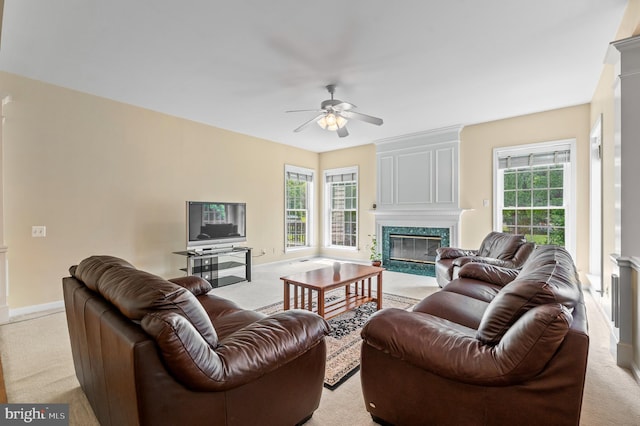 859 Empress Rd, West Chester, PA 19382 - living room with light carpet, a high end fireplace, a ceiling fan, and plenty of natural light