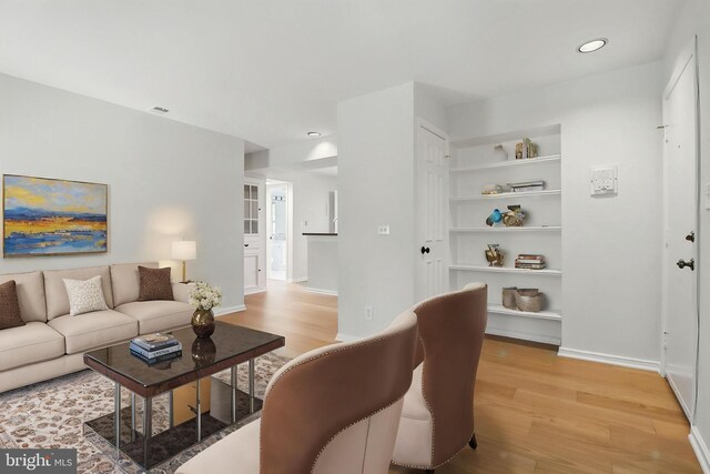 1403 E Abingdon Dr E Unit 3, Alexandria, VA 22314 - living room featuring light wood-type flooring, baseboards, built in shelves, and recessed lighting