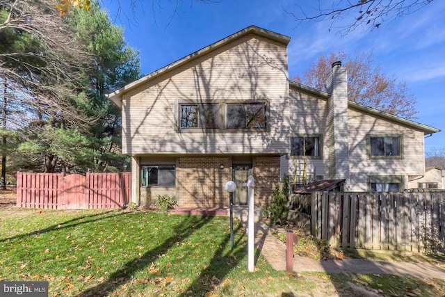 10627 Summer Oak Ct, Burke, VA 22015 - rear view of house featuring a chimney and brick siding