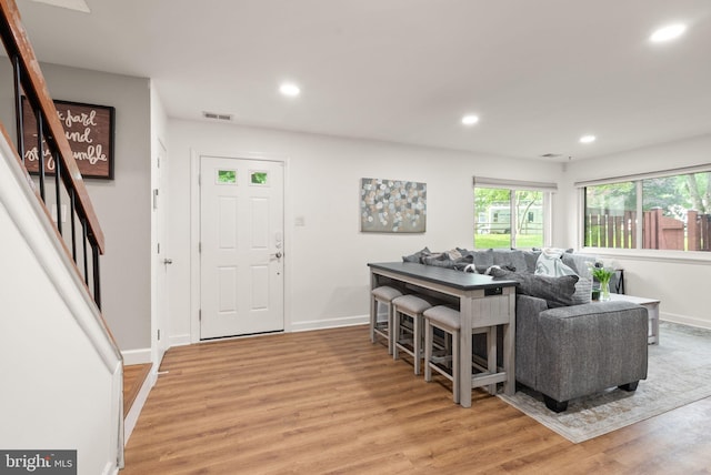 10627 Summer Oak Ct, Burke, VA 22015 - living room with light wood-style floors, recessed lighting, and stairway