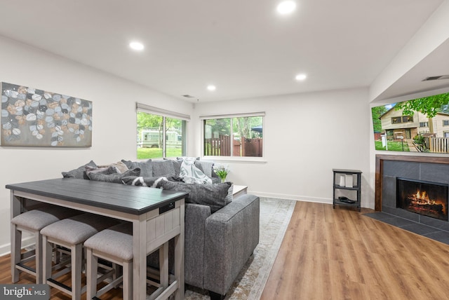 10627 Summer Oak Ct, Burke, VA 22015 - living room featuring wood finished floors, recessed lighting, and a tiled fireplace