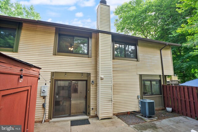 10627 Summer Oak Ct, Burke, VA 22015 - rear view of house featuring a chimney