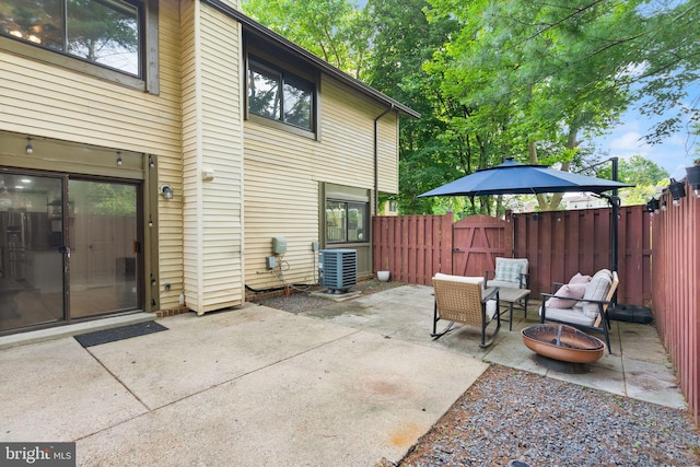 10627 Summer Oak Ct, Burke, VA 22015 - fenced backyard with a patio, a fire pit, and a gate