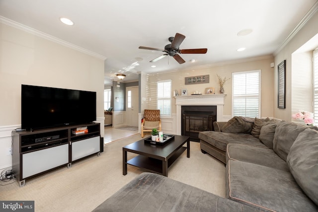 32 Granite Ln Unit 8, Chester Springs, PA 19425 - living area featuring a decorative wall, ceiling fan, ornamental molding, wainscoting, and a glass covered fireplace