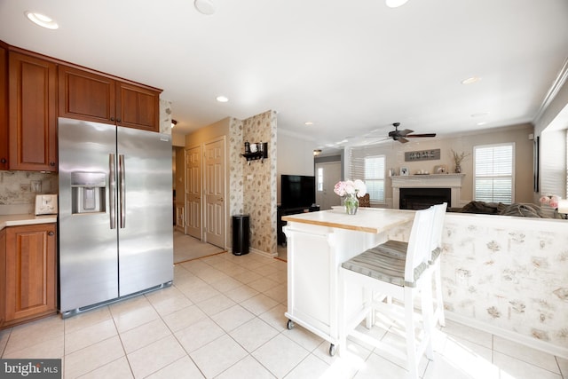 32 Granite Ln Unit 8, Chester Springs, PA 19425 - kitchen with stainless steel fridge with ice dispenser, a ceiling fan, open floor plan, crown molding, and light countertops