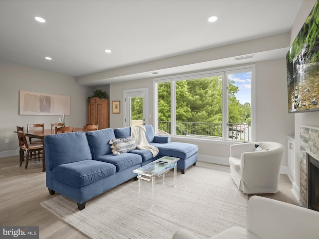 8101 Connecticut Ave Unit S 608, Chevy Chase, MD 20815 - living area featuring baseboards, healthy amount of natural light, wood finished floors, a fireplace, and recessed lighting