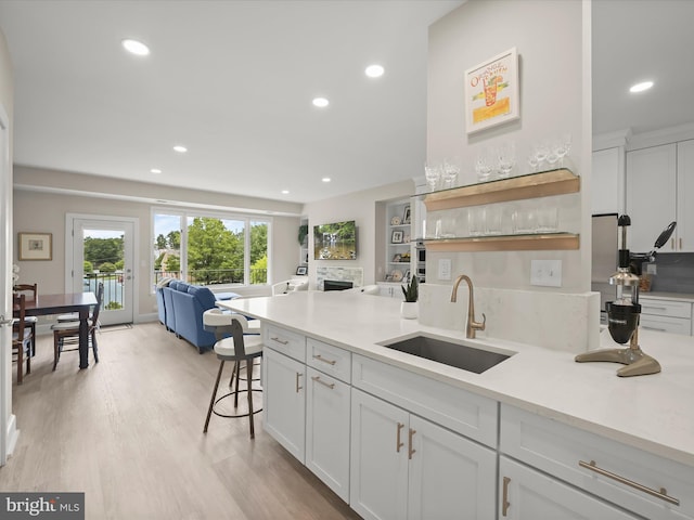 8101 Connecticut Ave Unit S 608, Chevy Chase, MD 20815 - kitchen featuring a sink, open floor plan, white cabinets, open shelves, and recessed lighting