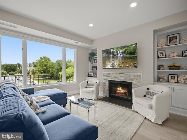 8101 Connecticut Ave Unit S 608, Chevy Chase, MD 20815 - living room with light wood-type flooring, a fireplace, recessed lighting, and built in features