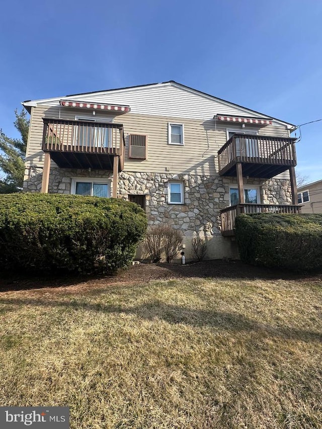 713A-2 Willow St # A-2, Lansdale, PA 19446 - rear view of house featuring stone siding, a yard, and a balcony