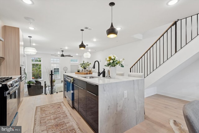122 E Sharpnack St, Philadelphia, PA 19119 - kitchen with appliances with stainless steel finishes, recessed lighting, light wood-style floors, open floor plan, and modern cabinets