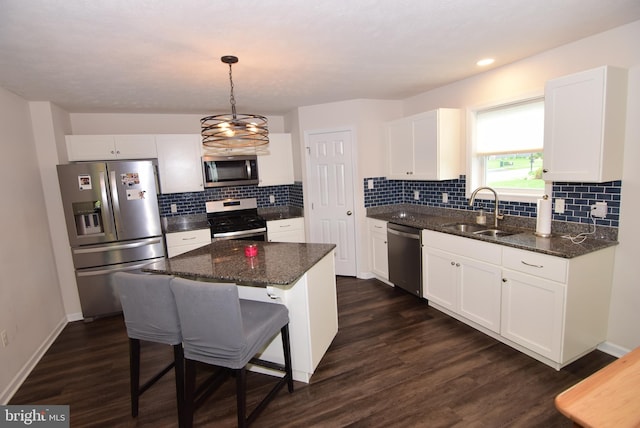 119 Shady Hollow Dr, Pleasant Gap, PA 16823 - kitchen featuring appliances with stainless steel finishes, a sink, white cabinets, dark wood-type flooring, and recessed lighting