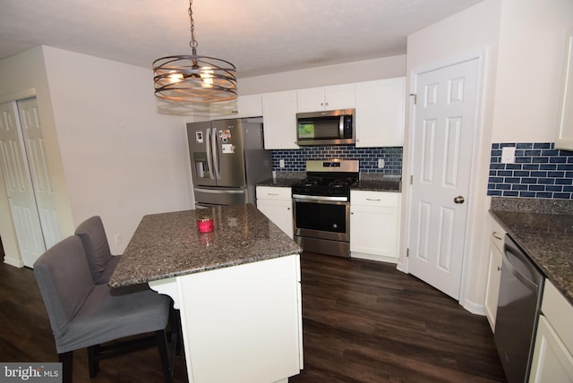 119 Shady Hollow Dr, Pleasant Gap, PA 16823 - kitchen featuring appliances with stainless steel finishes, a chandelier, decorative backsplash, and white cabinets