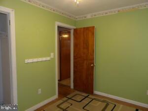 612 S Thomas St, Bedford, PA 15522 - unfurnished bedroom with baseboards