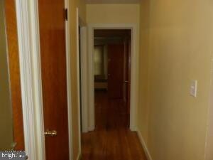 612 S Thomas St, Bedford, PA 15522 - hall featuring dark wood-style floors and baseboards
