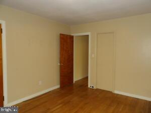 612 S Thomas St, Bedford, PA 15522 - empty room with wood finished floors and baseboards