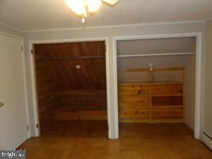 612 S Thomas St, Bedford, PA 15522 - unfurnished bedroom featuring two closets